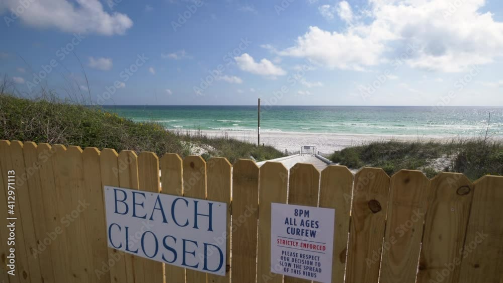 Closed beach sign during coronavirus pandemic in Florida