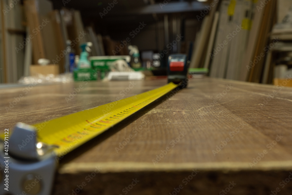 carpenter cutting wood with saw carpenter cutting wood with saw