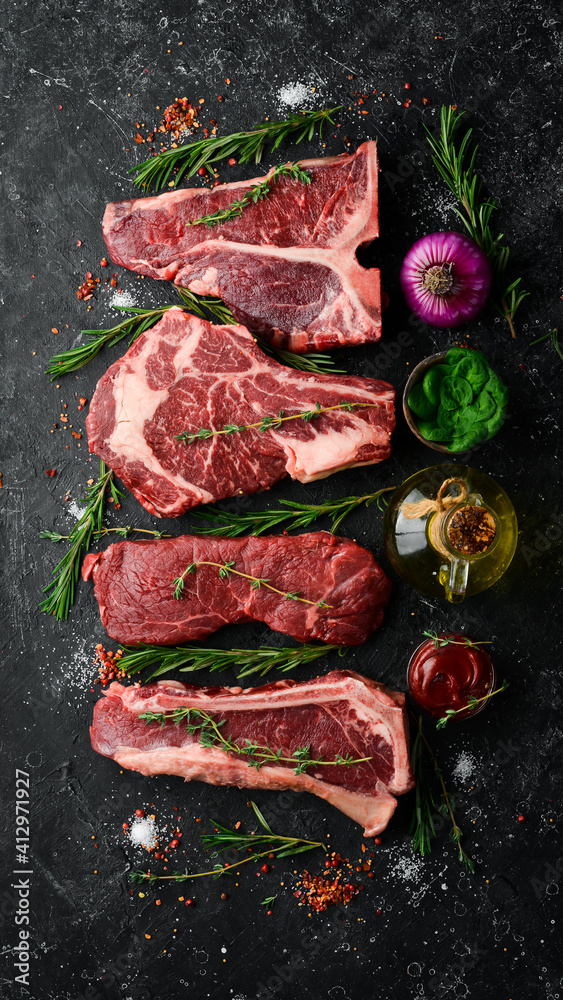 Variety of raw black Angus Prime meat steaks tbone, striploin, Rib
