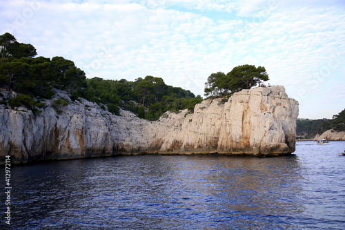 Group of people on the rocky wall overlooking the Mediterranean sea, Parc National des Calanques, Marseille, France
