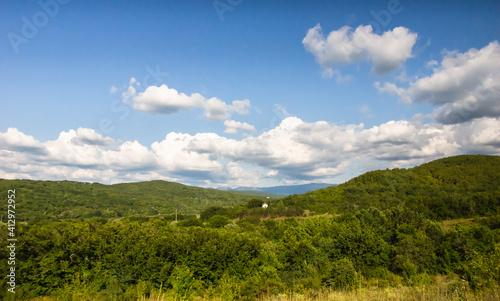Crimean mountains at sunny day under cloudy sky, summer day