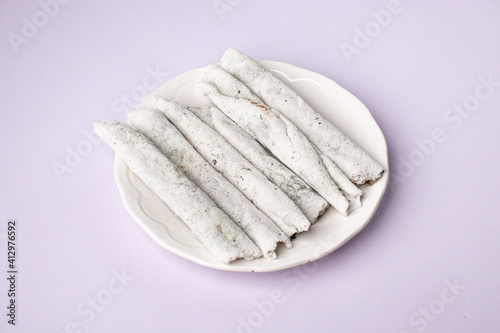 Til pitha a traditional food of Assam  isolated stock image. photo