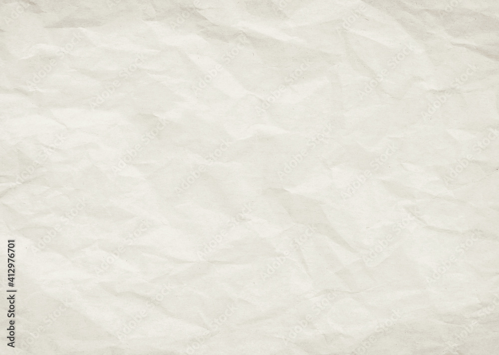 Naklejka premium Beige crumpled sheet of kraft paper with texture