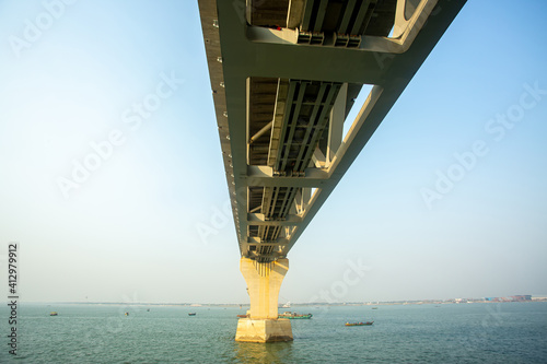 Bangladesh – February 06, 2021: A new PADMA Multipurpose Bridge is being constructed over the river Padma at Munshiganj, Dhaka, Bangladesh. photo