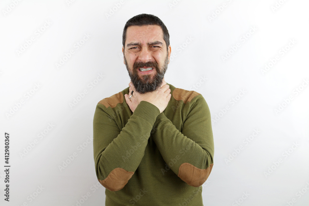Fototapeta premium Man with beard wearing casual clothes shouting and suffocate because painful strangle. health problem. asphyxiate and suicide concept.