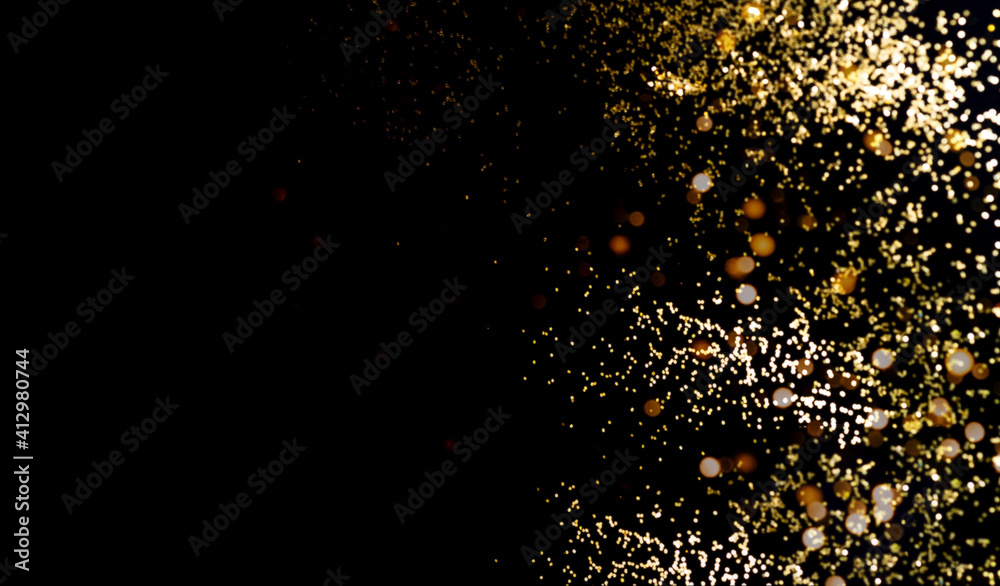 Abstract dark background with golden sparkles. Festive background. Blurred effect. Creative copy space