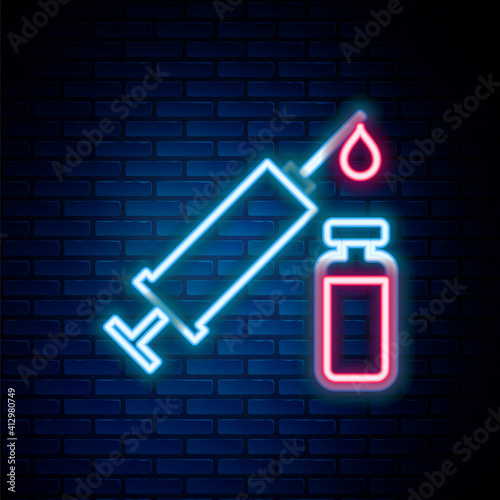Glowing neon line Medical syringe with needle and vial or ampoule icon isolated on brick wall background. Vaccination, injection, vaccine, insulin concept. Colorful outline concept. Vector.