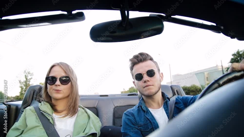 friends ride a convertible in summer on a sunny day, rent a car on a trip friends ride a convertible in summer on a sunny day, rent a car on a trip