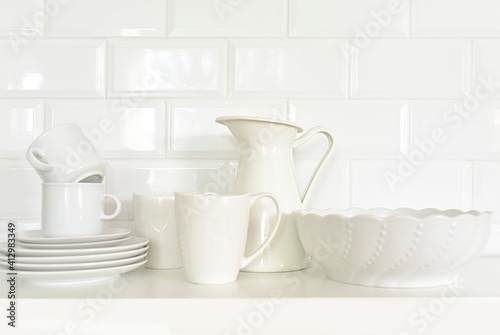white kitchen utensils on a white background in the kitchen