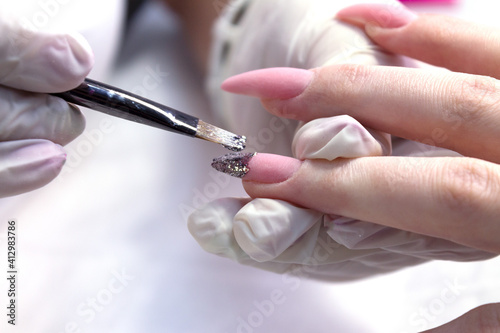 Nail design a shiny French jacket and hand-drawn black gel polish are covered with a glossy top.