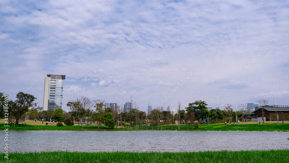 The city buildings are reflected by the water