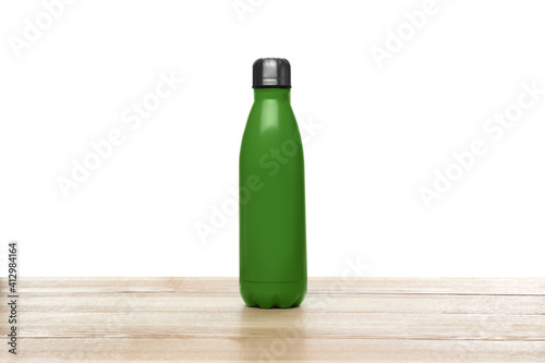 Stylish thermo bottle on wooden table against white background