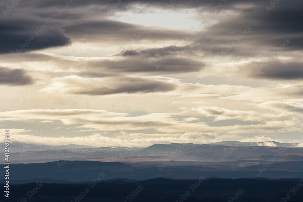 clouds in the sky, evening landscape with hills