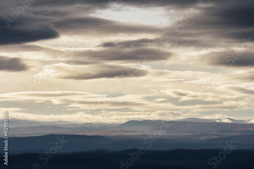 clouds in the sky, evening landscape with hills