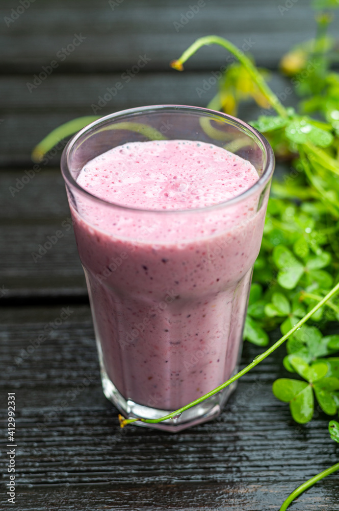 Berry smoothie with red berries and almond milk. Berry smoothie with red berries and almond milk.