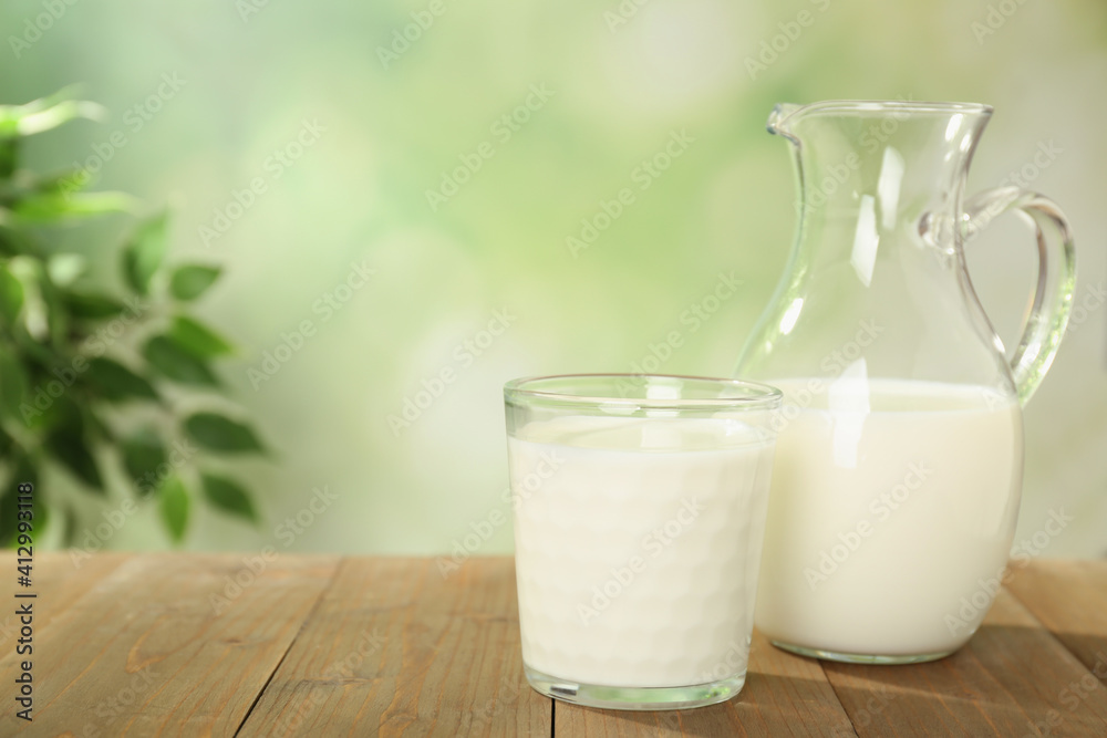 Delicious fresh milk on wooden table. Space for text Delicious fresh milk on wooden table. Space for text