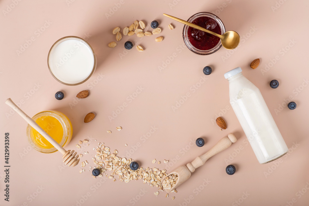 Fototapeta premium breakfast ingredients, oatmeal with berries and yoghurt