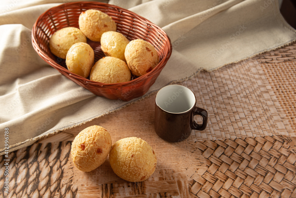 Cheese bread from Brazil, Arrangement with cheese bread, fabric and accessories on a table, selective focus.