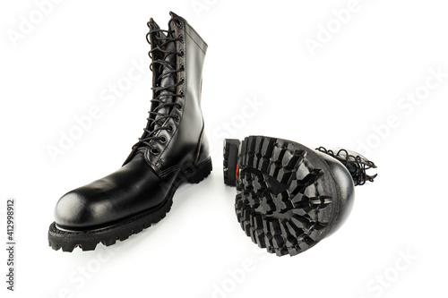 Billede på lærred pair of black leather 10-inch new black military combat boots, isolated on white