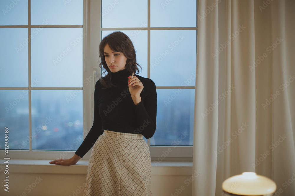 Thinking Woman Smoking a Cigarette in Room at Home Thinking Woman Smoking a Cigarette in Room at Home