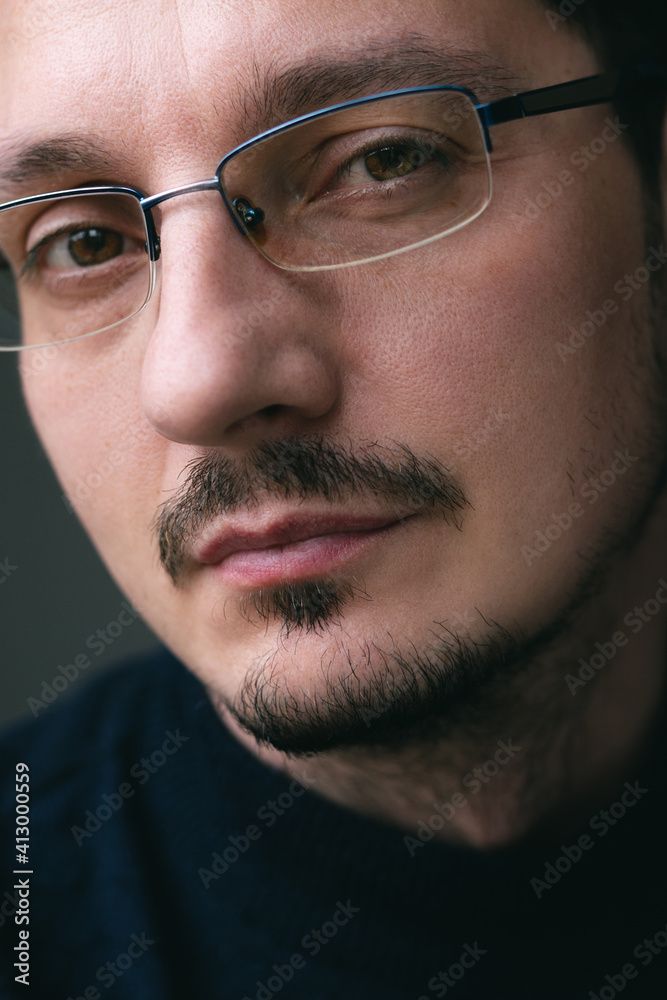 Close up portrait of attractive young man with eyeglasses looking at camera. Confident guy. Close up portrait of attractive young man with eyeglasses looking at camera. Confident guy.