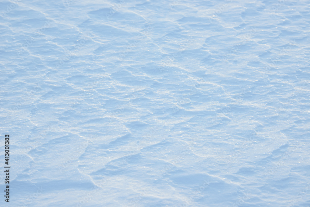 Obraz premium Fresh clean white snow background texture. Winter background with snowflakes and snow mounds. Snow lumps. Seasonal landscape details.
