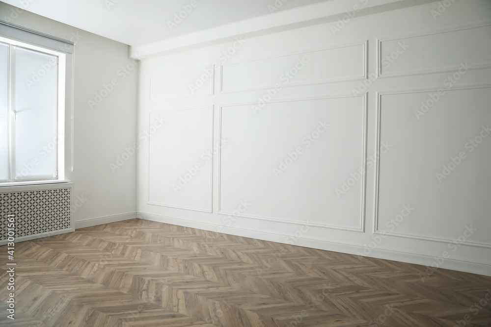 Parquet floor in light spacious empty room Parquet floor in light spacious empty room