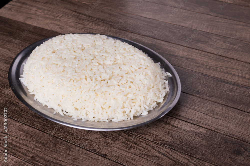 White rice in a tray. Gastronomic photograph of cooked white rice. White rice in a tray. Gastronomic photograph of cooked white rice.