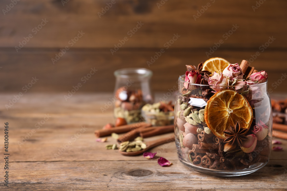 Aroma potpourri with different spices on wooden table, space for text Aroma potpourri with different spices on wooden table, space for text