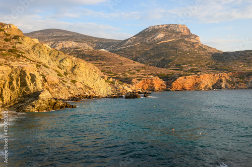 Beautiful cliffs on Agali beach on Folagandros island during sunset. Cyclades, Greece photo