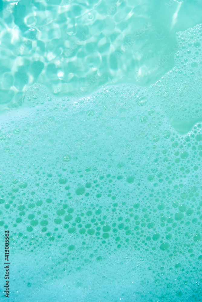 water foam and bubbles of blue color as background. cosmetology concept water foam and bubbles of blue color as background. cosmetology concept