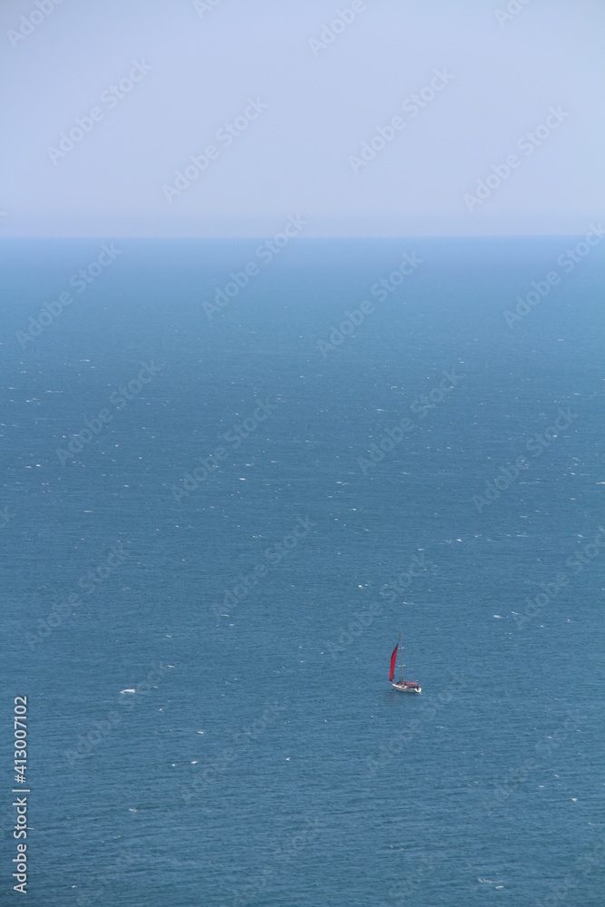  red boat  in the ocean