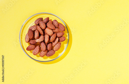 Heap of almonds on plate © vittoria