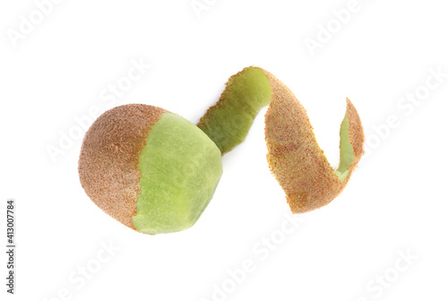 Whole fresh half peeled kiwi isolated on white photo