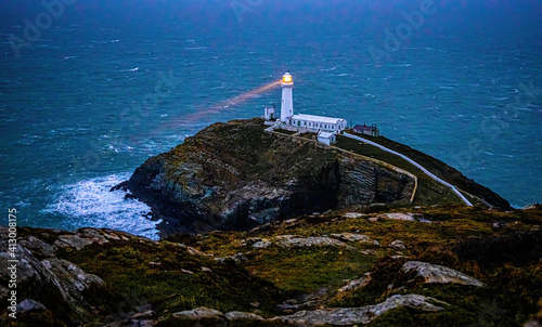 A lighthouse on South Stack, an island situated just off Holy Island on the northwest coast of Anglesey in Wales photo