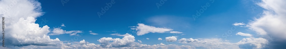 Fuffy clouds in blue sky. Summer good weather skyscape high resolution background.