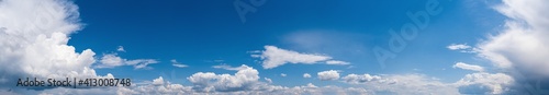 Fuffy clouds in blue sky. Summer good weather skyscape high resolution background.