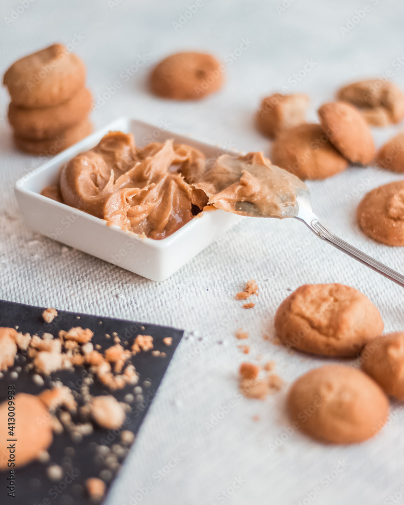 Cookies with peanut butter on a light table, cooking process