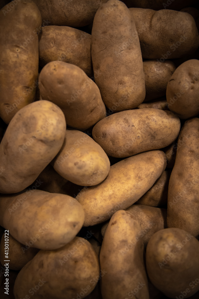 detail of a pile of potatoes filling the frame detail of a pile of potatoes filling the frame