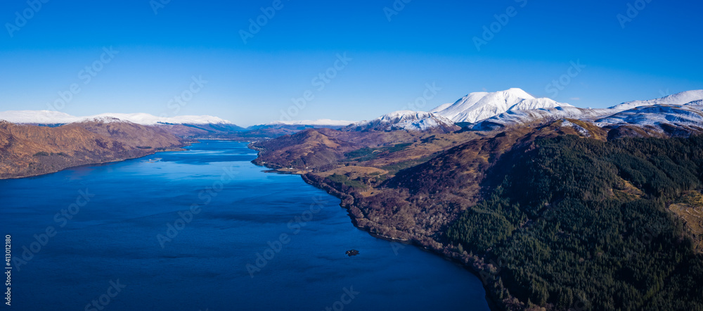 an aerial view of loch linnhe and ben nevis near fort william in winter in the argyll region of the highlands of scotland on a clear blue cold day