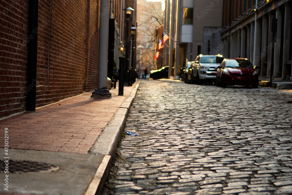 Cobblestone Street in a City at Sunset
