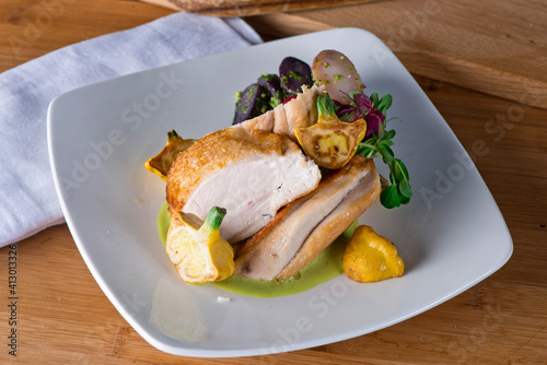 Chicken breast. Chicken pan seared to a crispy golden brown in brown butter and served with fresh organic vegetables: carrots, Brussels sprouts and green beans. Classic American restaurant favorite.