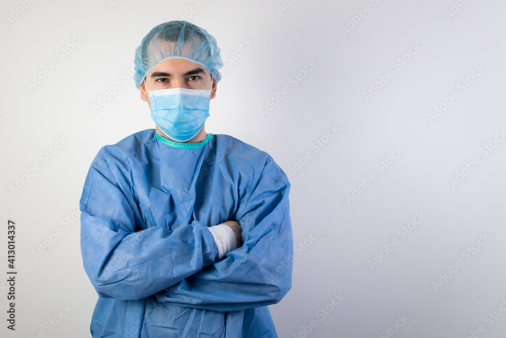 the main subject is out of focus, young male surgeon stand smile health care the main subject is out of focus, young male surgeon stand smile health care