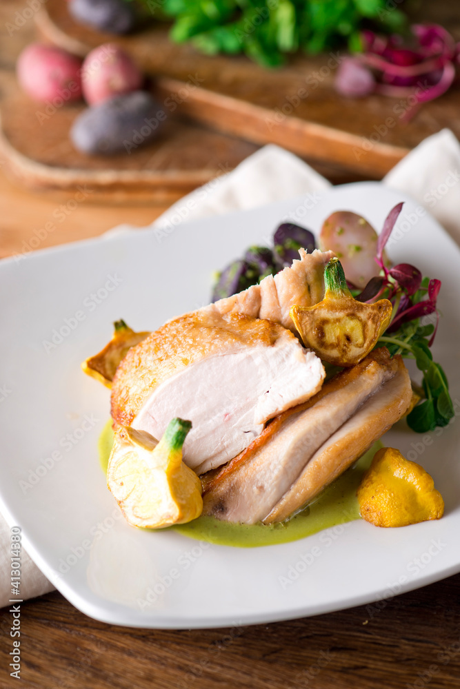 Chicken breast. Chicken pan seared to a crispy golden brown in brown butter and served with fresh organic vegetables: carrots, Brussels sprouts and green beans. Classic American restaurant favorite. Chicken breast. Chicken pan seared to a crispy golden brown in brown butter and served with fresh organic vegetables: carrots, Brussels sprouts and green beans. Classic American restaurant favorite.