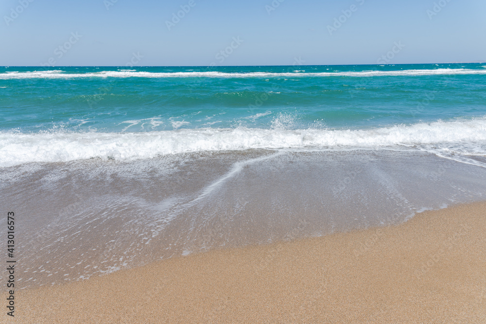 Empty beach and blue sky. Mediterranean summer vacation destination, Heraklion, Crete, Greece.