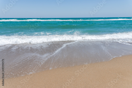 Empty beach and blue sky. Mediterranean summer vacation destination  Heraklion  Crete  Greece.