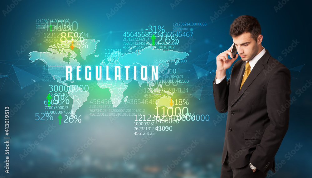 Businessman in front of a decision with REGULATION inscription, business concept