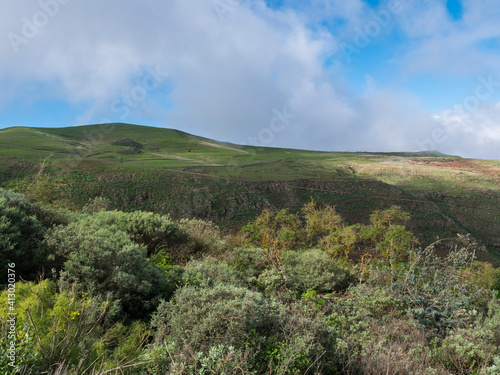 View of Gran Canaria rural landscape with green hills and fields, Canary island, Spain