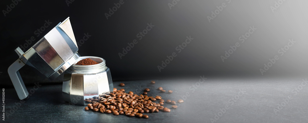Coffee in a moka pot with coffee beans and ground coffee on blur dark background. Preparing fresh traditional italian espresso coffee. Banner concept.