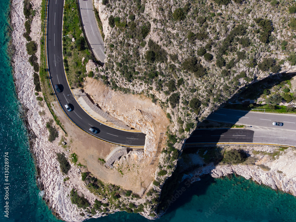 Aerial top down view of the road at Karamanli's Hole area in Agia Marina, Koropi